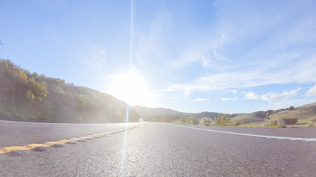 Basking in the beauty of a sunny winter day, driving on HWY 1 near Las Cruces, California offers stunning views of the picturesque coastal landscape against a backdrop of clear blue skies.の写真素材