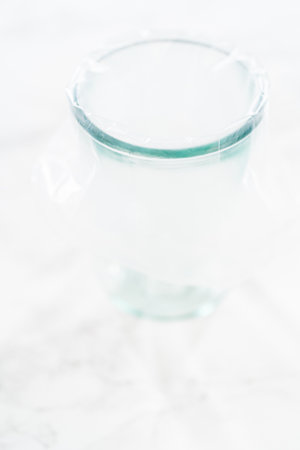 Piping bag is expertly filled with luscious caramel to be delicately infused into each of these decadent chocolate cupcakes.の写真素材