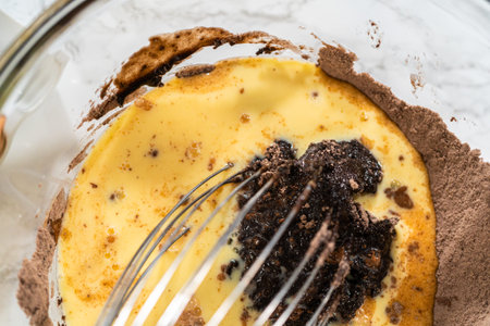 In the process of creating mouthwatering chocolate cupcakes, the first step involves meticulously...
