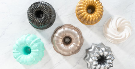 Flat lay. Variety of bundt cake pans on the kitchen counter.の写真素材