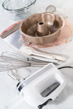 Kitchen tools for baking bundt cakes on the kitchen counter.の写真素材