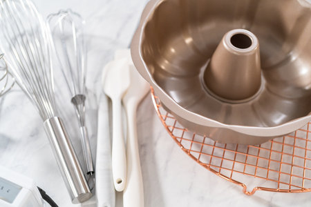 Kitchen tools for baking bundt cakes on the kitchen counter.の写真素材