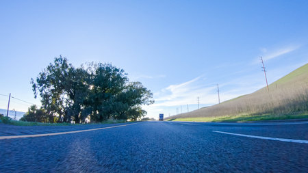 During the day, driving on HWY 101 near Arroyo Quemada Beach, California, offers scenic views of the surrounding coastal landscape.の写真素材