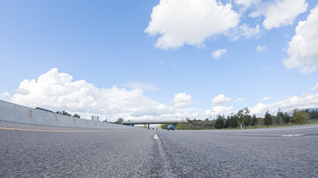On a clear winter day, a car smoothly travels along Highway 101 near Santa Maria, California, under...