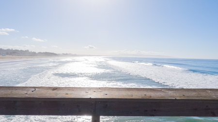 Pismo Beach is strikingly empty during a winter day, offering a serene and peaceful atmosphere with its expansive sandy shore and the soothing sounds of the waves.の写真素材