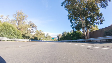 On a crisp winter day, a car cruises along the iconic Highway 1 near San Luis Obispo, California....