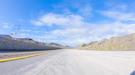 On a crisp winter day, a car cruises along the iconic Highway 101 near San Luis Obispo, California....