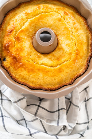 Allowing the freshly baked bundt cake to gradually cool down prior to extracting it from the pan is...