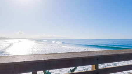 Pismo Beach is strikingly empty during a winter day, offering a serene and peaceful atmosphere with its expansive sandy shore and the soothing sounds of the waves.の写真素材