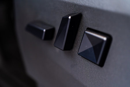 Denver, Colorado, USA-May 5, 2024-This image captures a close-up view of the seat adjustment buttons located in the Tesla Cybertruck, emphasizing the minimalist and sleek design of the vehicle interior controls.のeditorial素材
