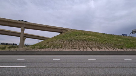 A dynamic view of the elevated highway overpass in South Denver, showcasing the intricate concrete...