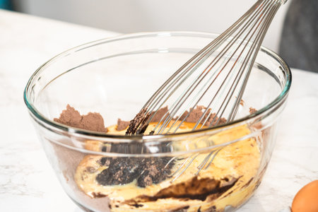 In the process of creating mouthwatering chocolate cupcakes, the first step involves meticulously...