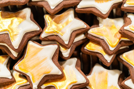 Captured from a macro perspective, a stack of golden star-shaped cookies with a rich chocolate base...