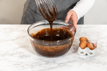 In the process of creating mouthwatering chocolate cupcakes, the first step involves meticulously...