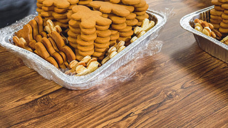 Golden-hued cookies shaped like snowflakes, intricately stacked.