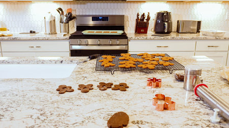 After baking to perfection, these delightful gingerbread cookies are now cooling gracefully on a...