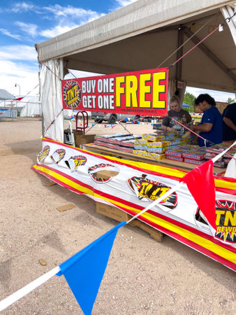 Parker, Colorado, USA-July 3, 2025 - An open tent with TNT Fireworks branding showcasing a Buy One...