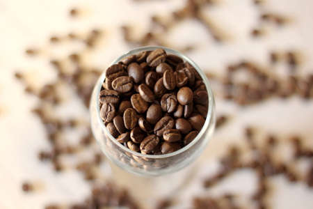 glass with coffee beans on a white backgroundの写真素材
