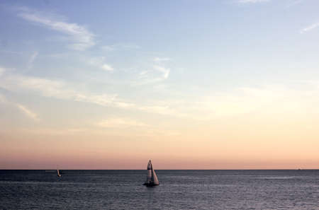 yacht sailing in the black sea at sunsetの写真素材