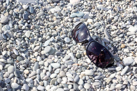 sunglasses on the stone beachの写真素材
