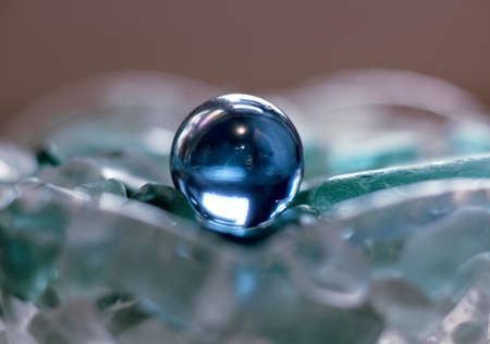 blue bead on the white and blue glassの写真素材