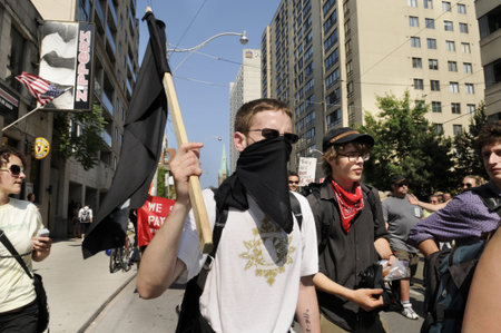 TORONTO-JUNE 25: Members of The black anarchist group who was later accused of vandalizing shops and...