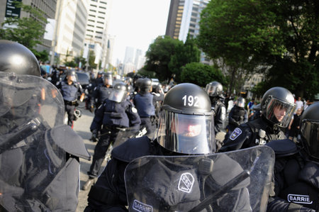 TORONTO-JUNE 25: Police in Riot gear keeping eyes on the protesters during the G20 Protest on June...