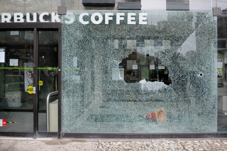 TORONTO-JUNE 26: StarBucks coffee shop window was smashed during G20 protests on June, 26 2010 in...