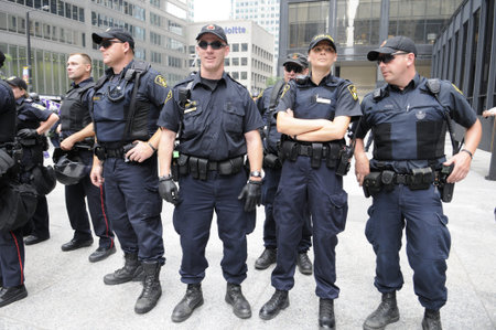 TORONTO-JUNE 27: Toronto police officers standing in front of the TD Tower a major financial...
