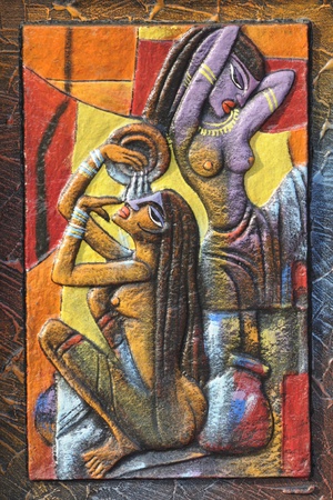 KOLKATA - FEBRUARY 23: An abstract art of a tribal women bathing on display during the Handicraft Fair in Kolkata-the biggest of its kind in Asia on February 23,2011 in Kolkata,India.のeditorial素材