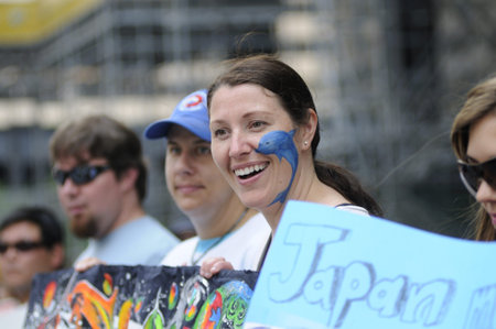 TORONTO-AUGUST 31: Happy protesters during a rally to protest the start of the annual dolphin hunt...