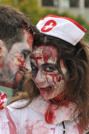 TORONTO-OCTOBER 20: A couple sharing a pose during the Halloween parade on October 20, 2012 in Toronto, Canada.のeditorial素材