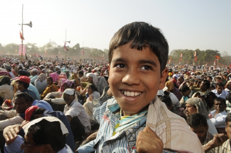 KOLKATA- FEBRUARY 13: A small kid sharing a laugh during a political rally in Kolkata, India on February 13, 2011.のeditorial素材