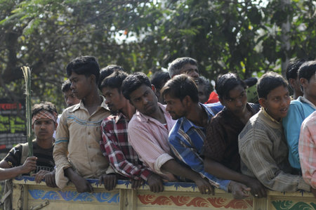 KOLKATA- FEBRUARY 13: Supporters from the rural parts with mixed reactions on their way to the rally ground, during a political rally in Kolkata, India on February 13, 2011.のeditorial素材