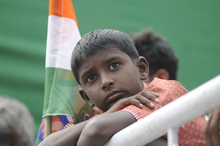 KOLKATA - FEBRUARY 20: A children listening to the speeches during a rally organized by All India Trinamool Congress to kick the 2011 election champagne, in Kolkata, India on February 20, 2011.のeditorial素材