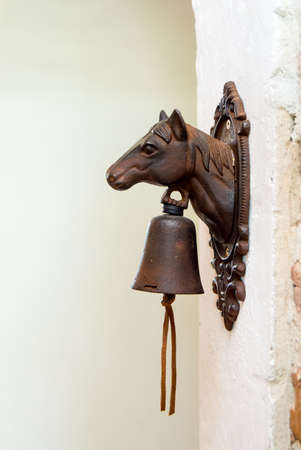 Horse doorbell on white wallの写真素材
