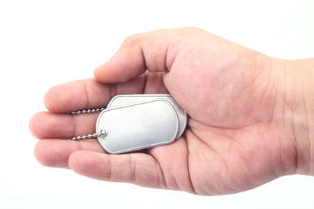 dog tag on the handの写真素材