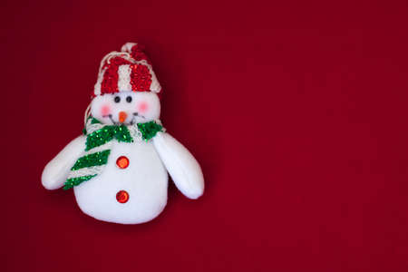 White snowman on red backgroundの写真素材