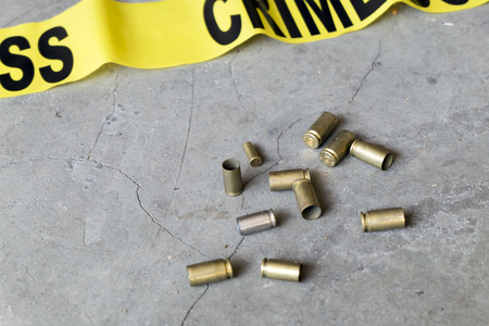 Crime scene concept with crime tape and casingsの写真素材