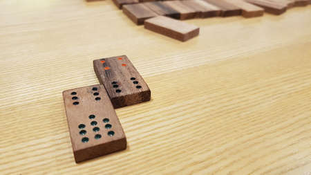 Pieces of wooden domino on the tableの写真素材