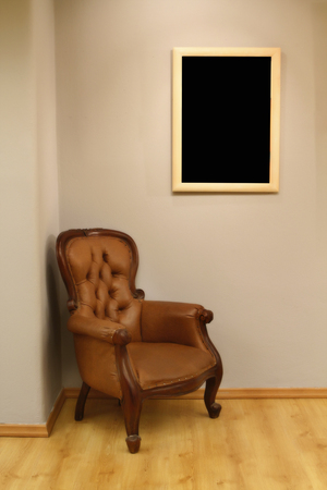 Blank frame exhibotion room gallery with armchairの写真素材