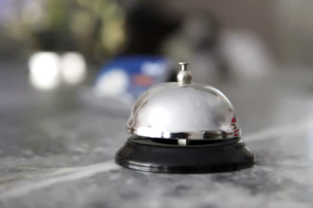 Recepion bell on desk in hotelの写真素材
