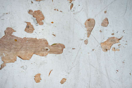 White wood plank as background. Grunge texture wallpaper. Peeling paint on an old wooden floor. Space for text in template. Empty concept.の写真素材