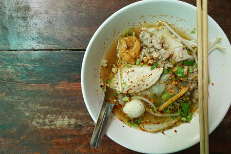 Thai food style,Top view noodle on old wood background(KUAY TEAW), Healthy food concept, Spicy...
