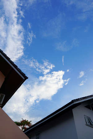 Looking up roof with home on blue sky and clouds, Beautiful nature blue sky with clouds, cloudscape...