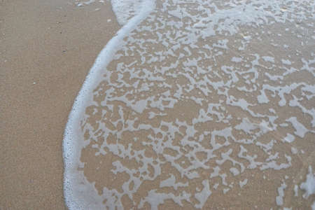 Soft wave of the sea on the sandy beach. Sea with little wave at Cha am, Thailand. Abstract...
