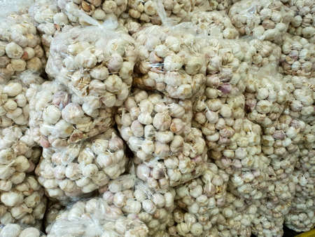 Garlic in a bag on the market at Thailand, Top view (Allium sativum)