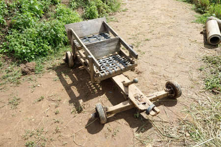 Top view of car made from wooden on the road, interesting toy