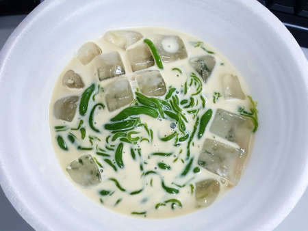 Top view of Chendol dessert in coconut milk at street food in Thailand, Lod Chong is thai...