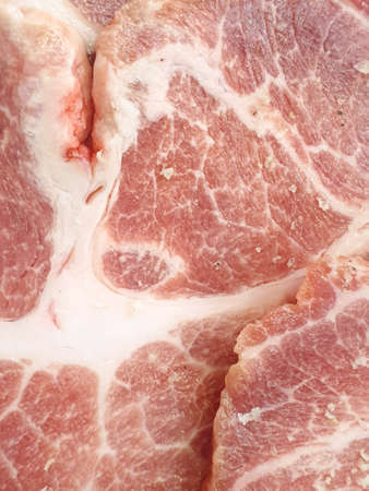 Top view of pork collar sliced as a background in the market for sale at Thailand, fresh meat for...